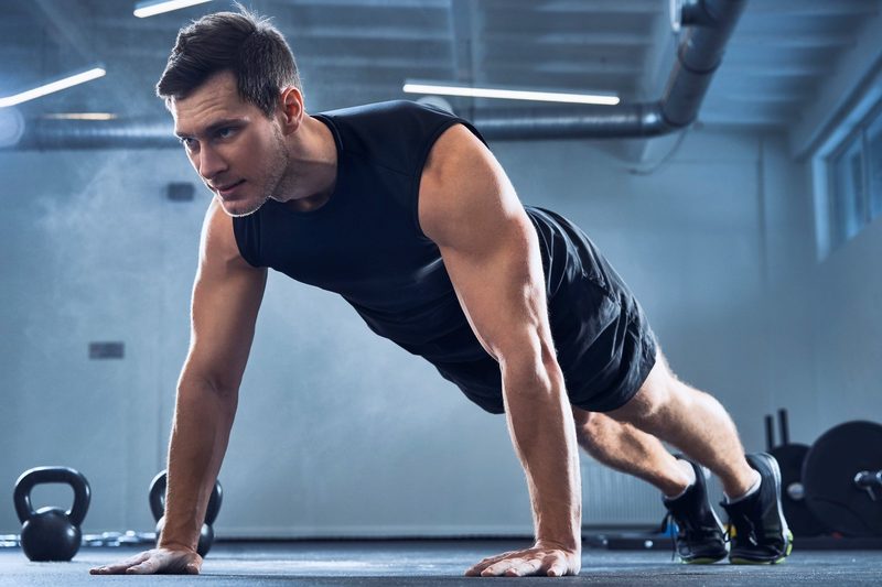 Man doing pushups at a gym