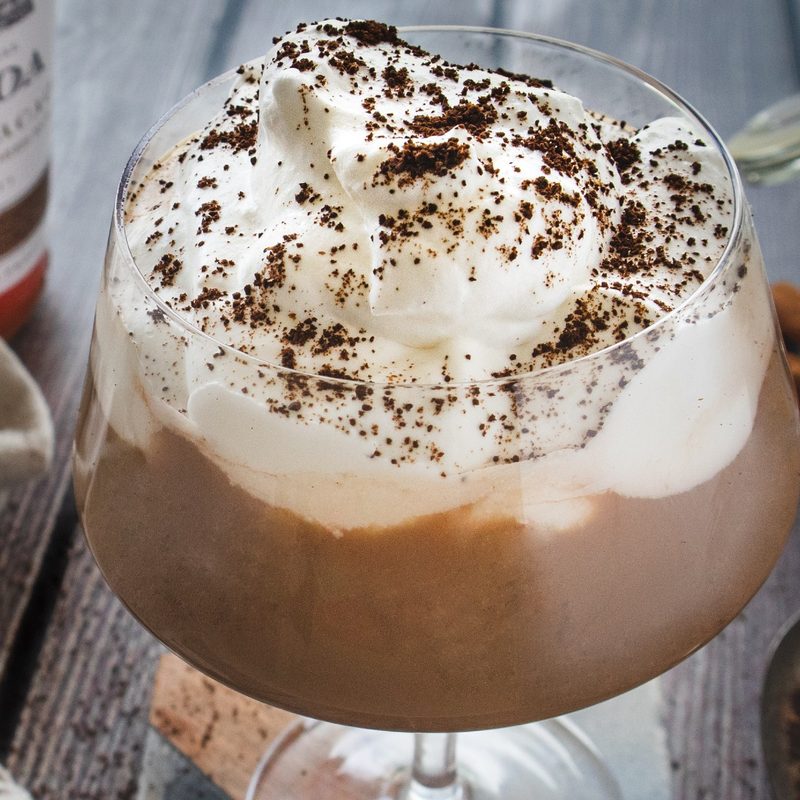 Rum and Caramel Spiked Hot Cocoa on table.