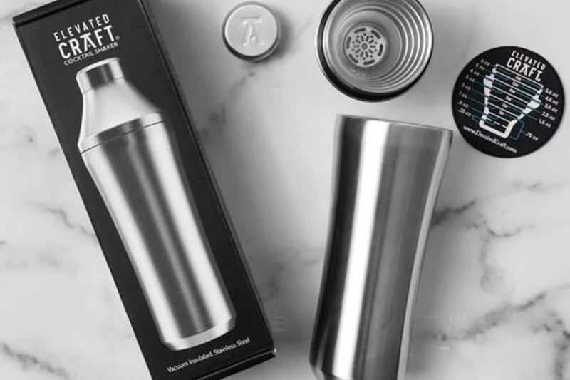 Elevated Craft Cocktail Shaker laying on the marble counter.