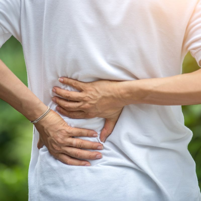 A man experiencing back pain.