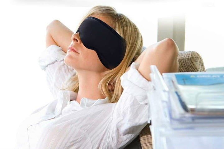 Woman using Sleepace Sleep headphones With Eye Mask.