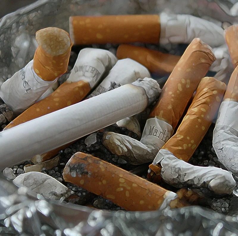Ashtray with cigarettes.
