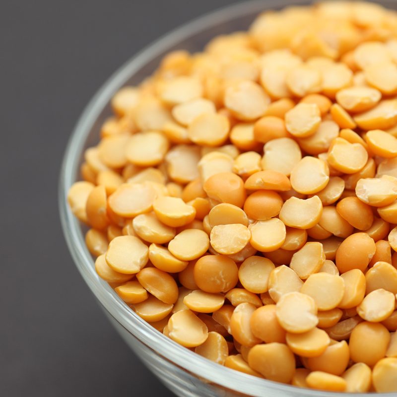 A close-up of a bowl of split peas.