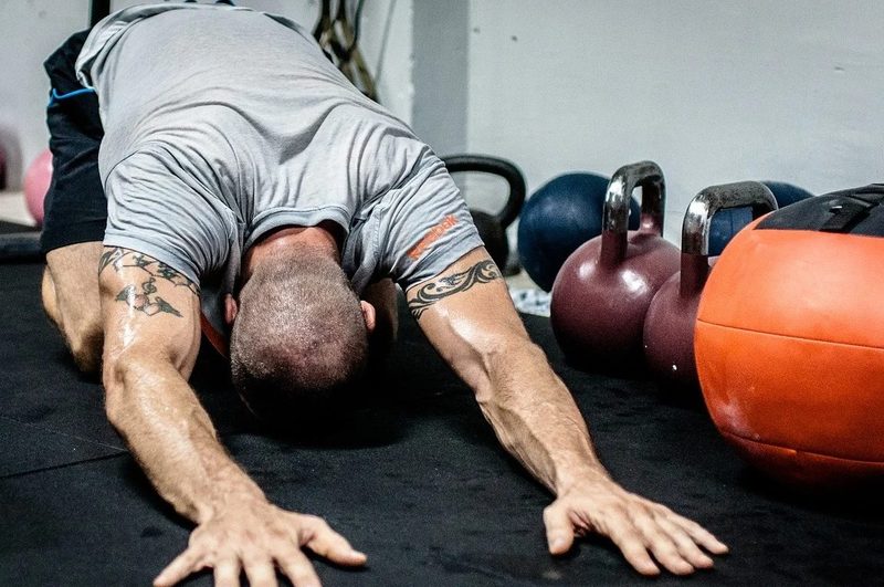 Man doing child's pose stretch