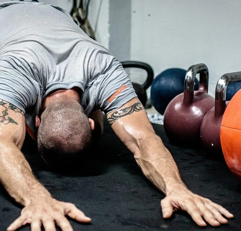 Man doing child's pose stretch