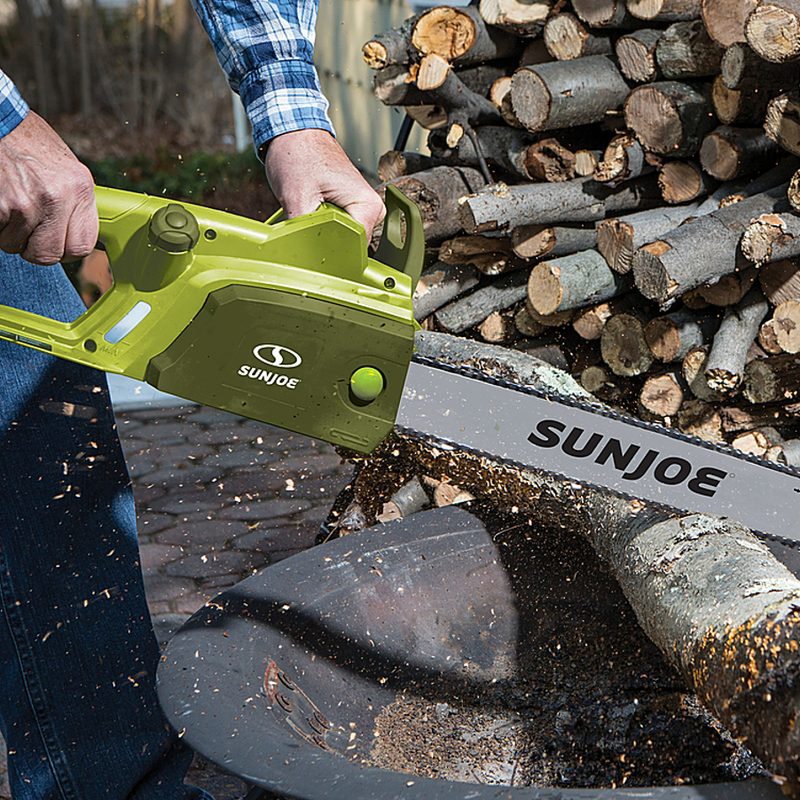 Sun Joe SWJ701E Electric Chain Saw cutting wood.