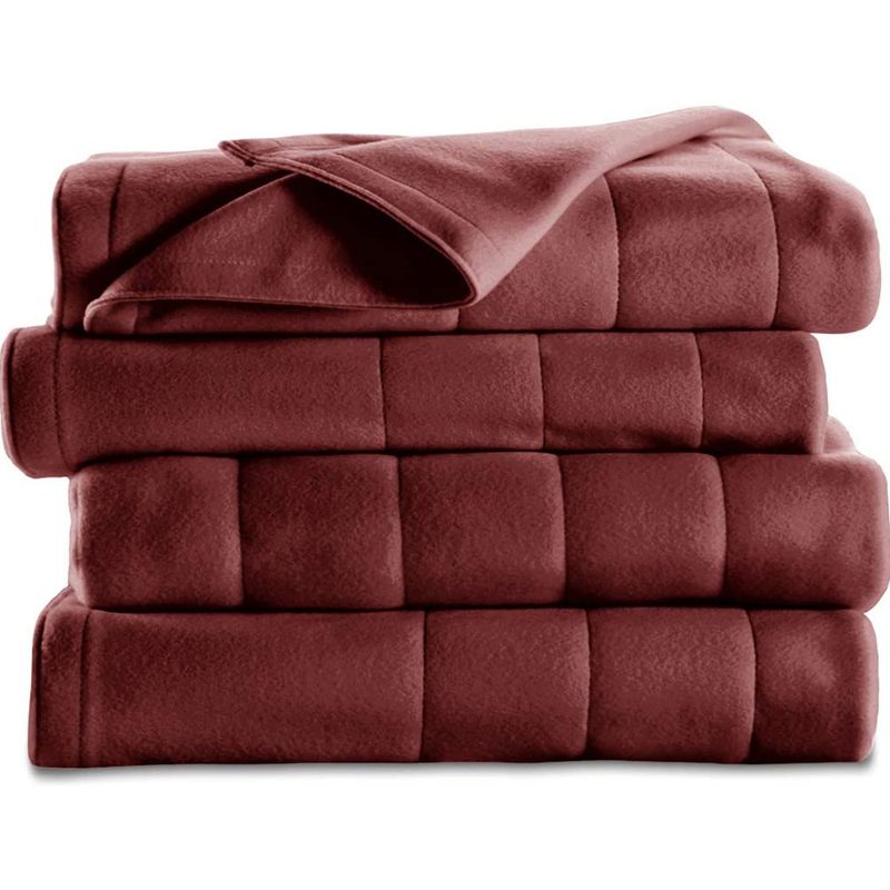 A red Sunbeam Quilted Fleece Heated Blanket on white background.
