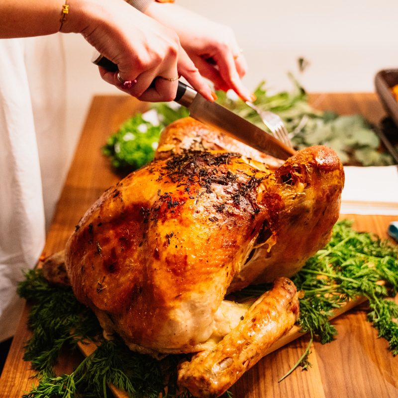Turkey being carved on a cutting board