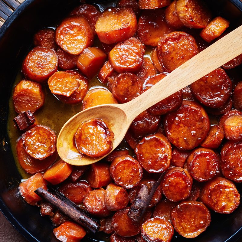 Sweet potatoes cooked with cinnamon on a pan.