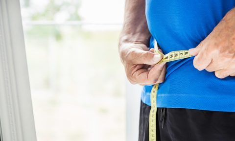 Person measuring waist