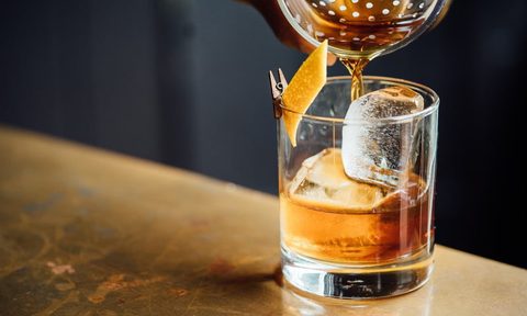 Whiskey being poured into a glass