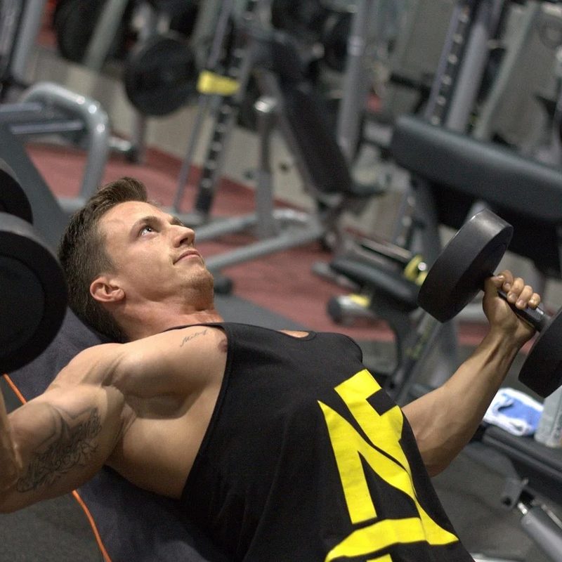 Man working out using dumbbells.