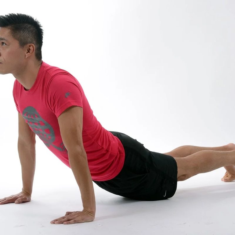 Man doing yoga up dog.