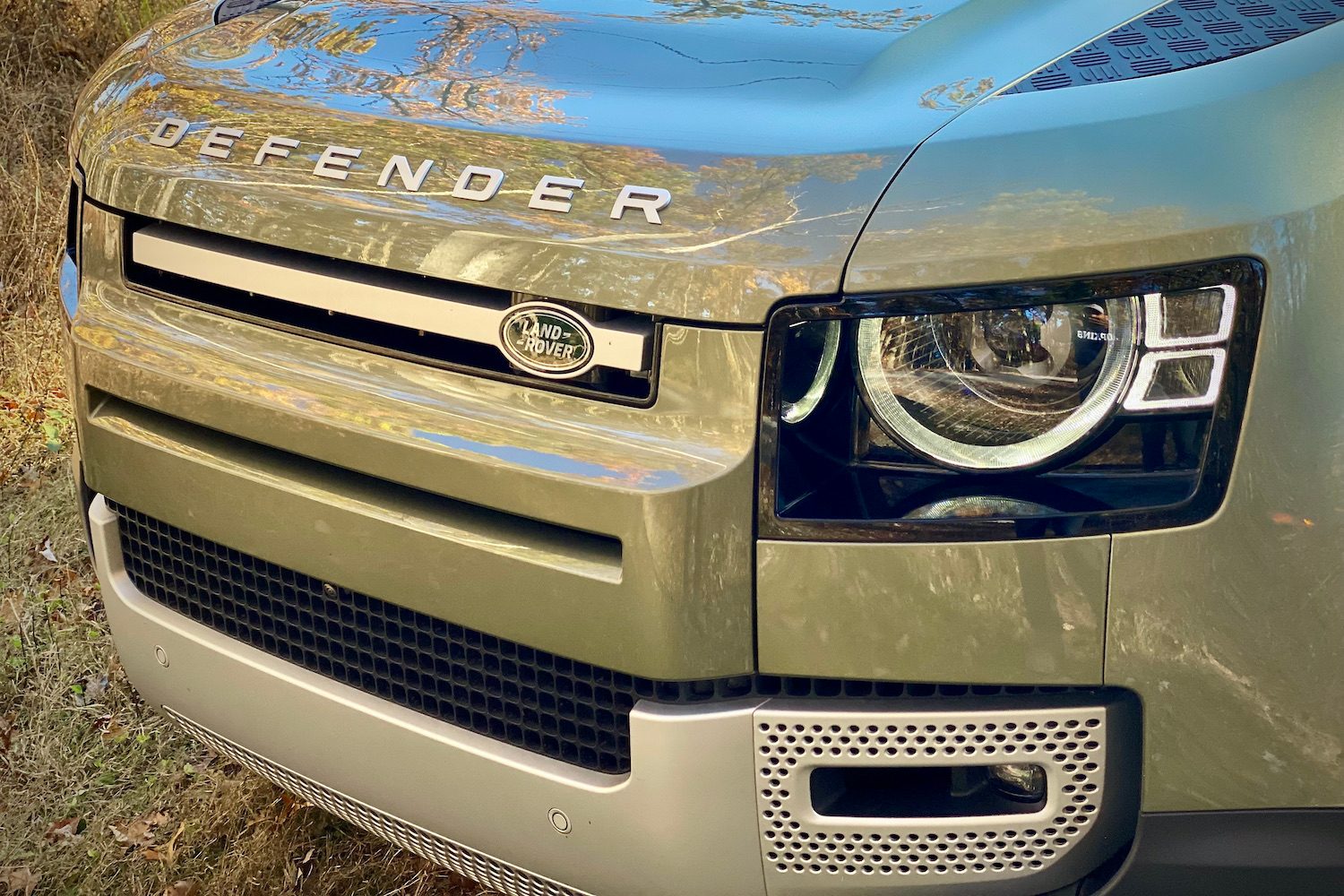 Close up of Land Rover Defender headlight and grille.