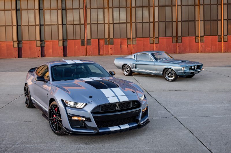 A 2022 Ford Mustang Shelby GT500 Heritage Edition with a 1968 Shelby GT500 in the background.