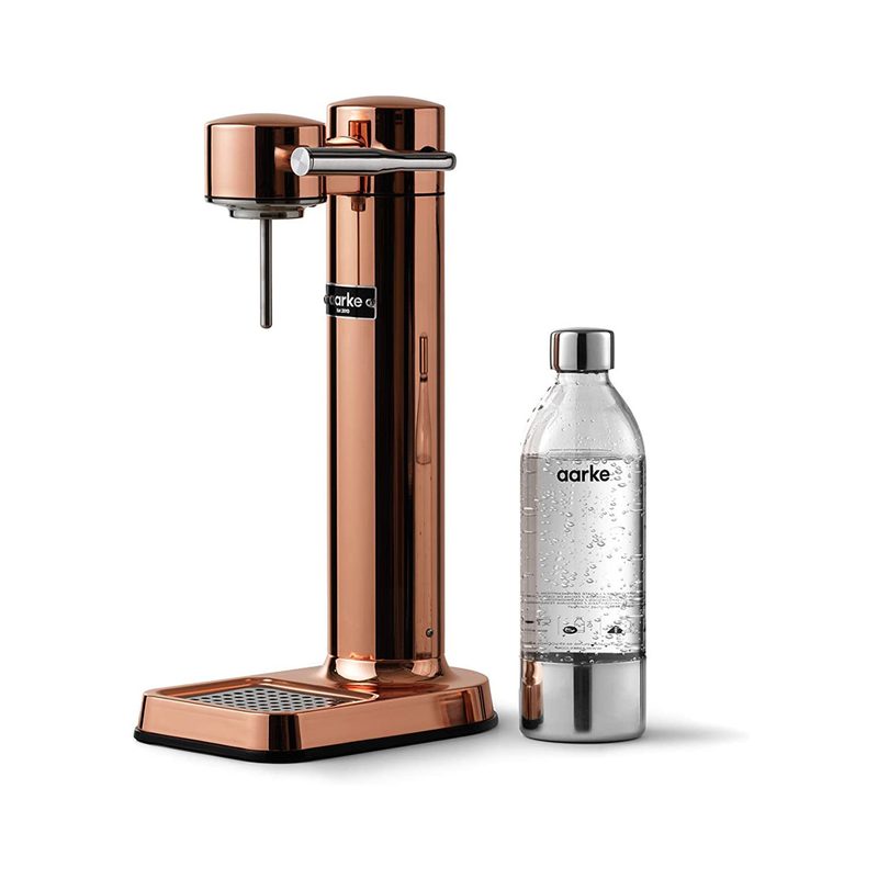 A Aarke Carbonator 3 beside a water bottle.