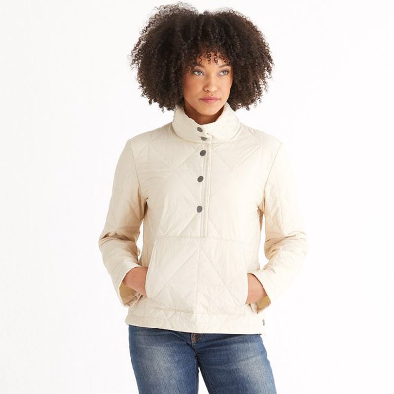 A woman wearing an Aether Marsh Pullover and jeans.