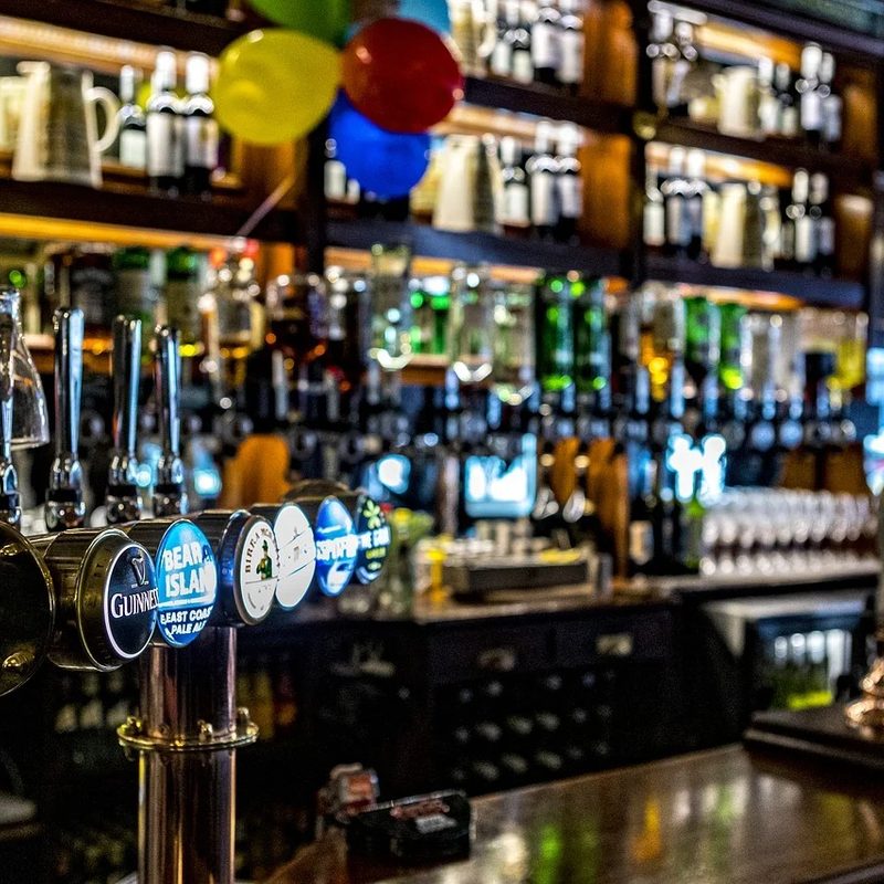 Beer taps at a bar.