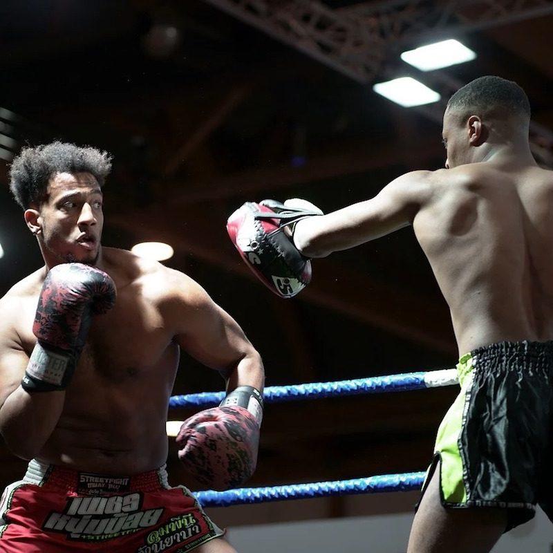 Two men boxing in the ring