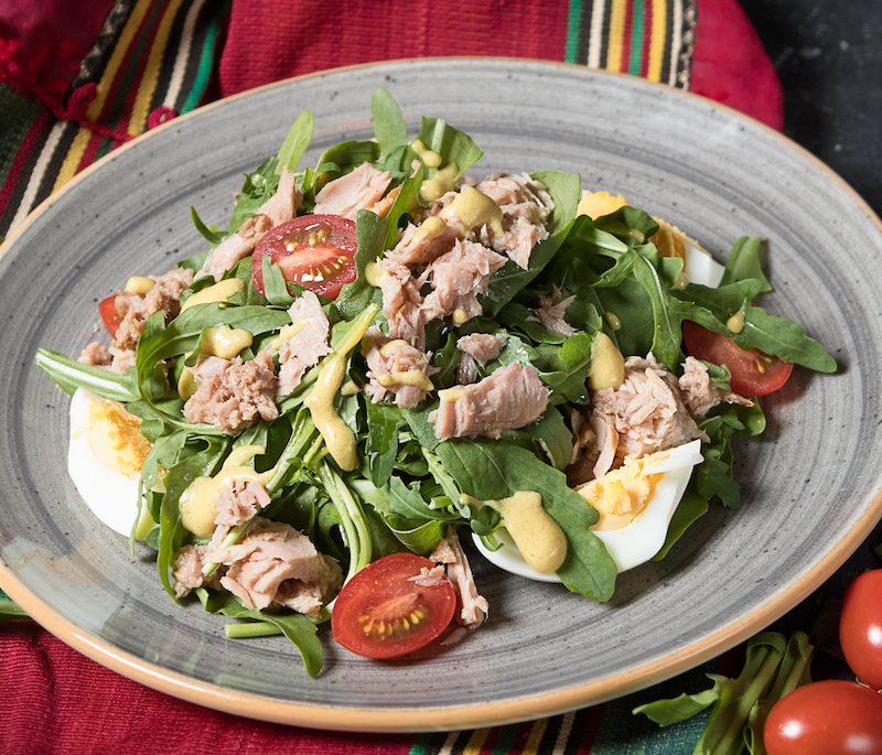 Canned tuna with mixed greens salad and eggs.