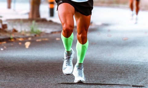 Runner wearing compression socks during a race.