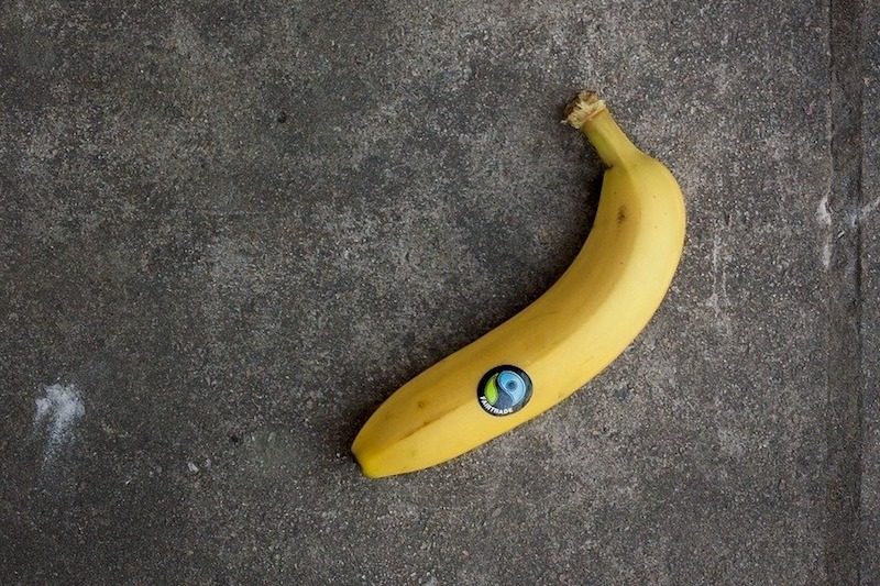 banana with a fair trade sticker.