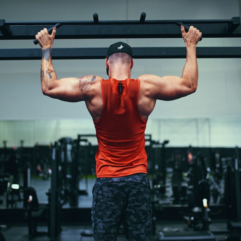 Man doing pull-ups.