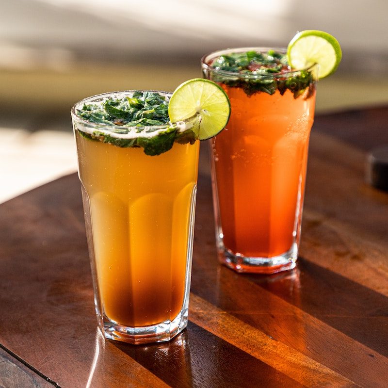 A pair of mocktails on a table.