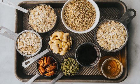 Tray of gluten-free foods like oats and seeds.