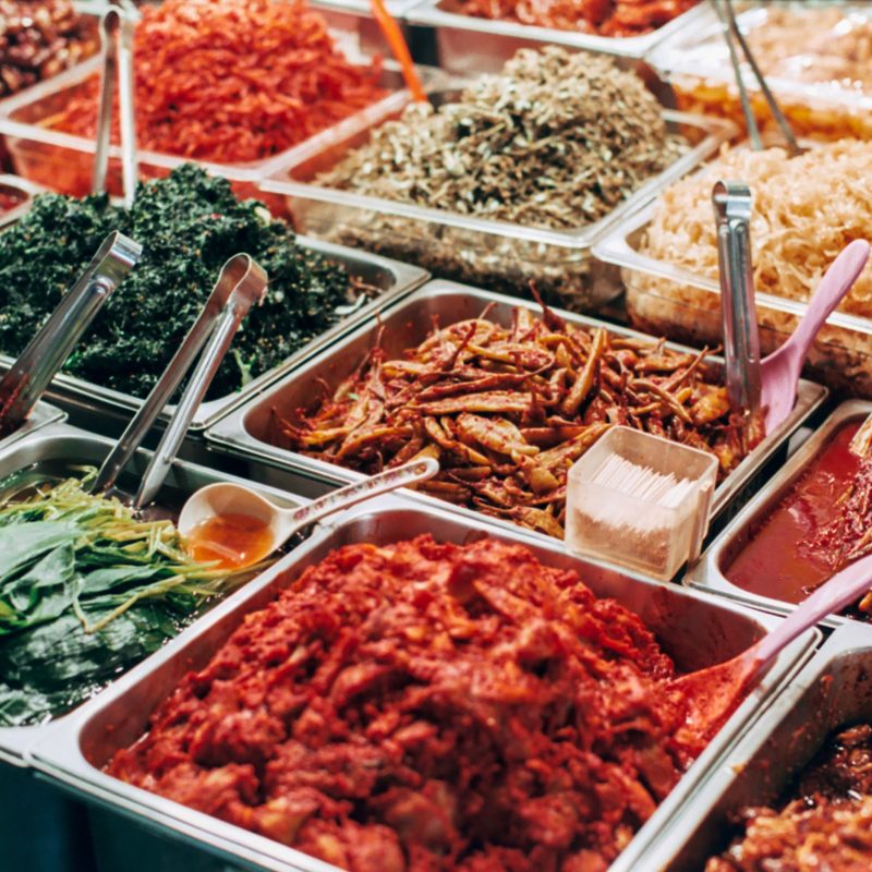 Various Korean banchans on display at market.