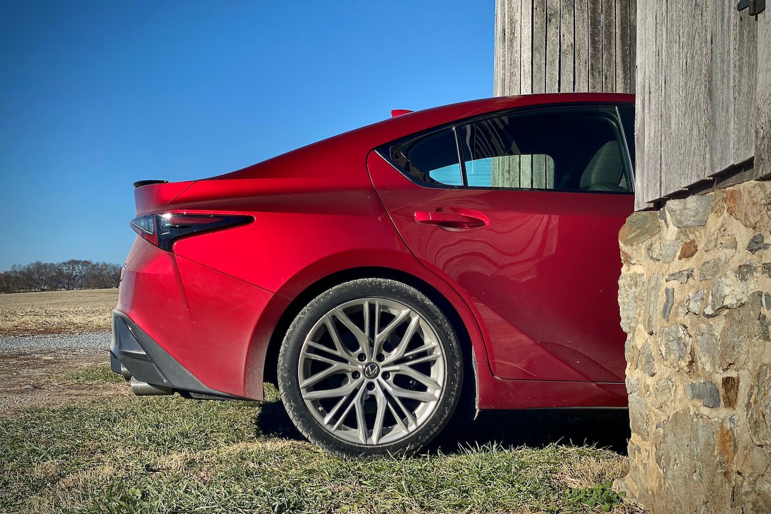 Side rear profile of Lexus IS 500 rear end from passenger's side.