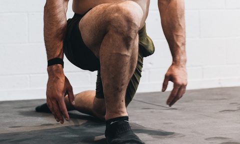 Man doing quad exercises at home