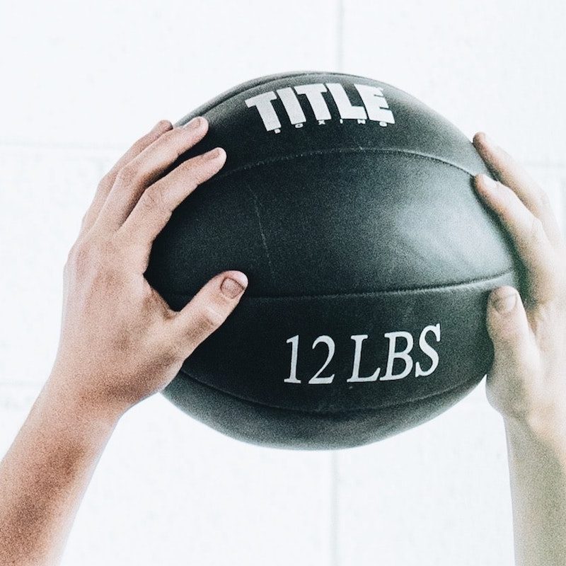 medicine ball in hands.