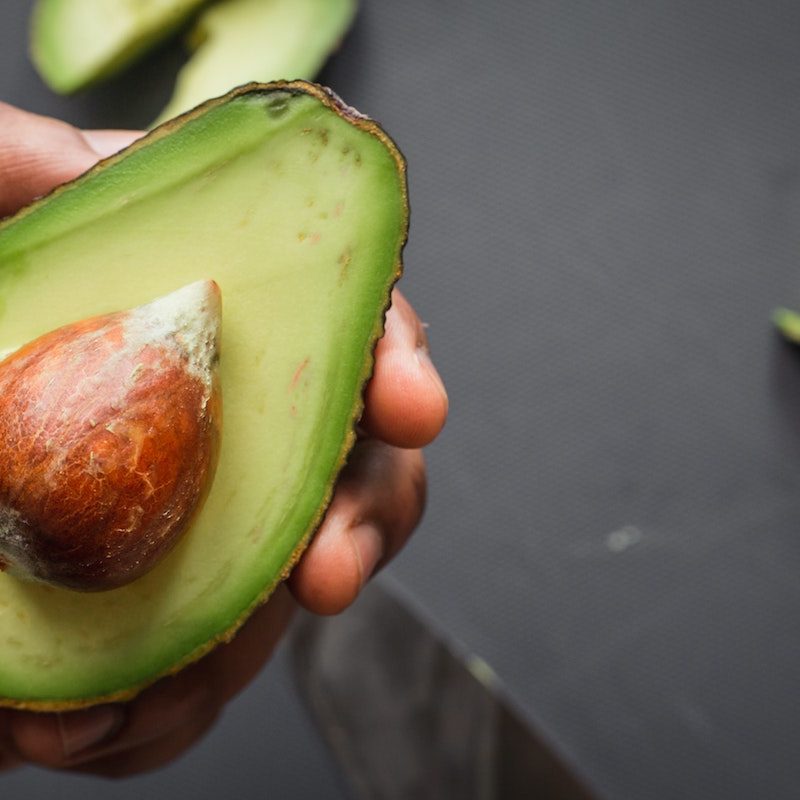 Avocado in someone's hand