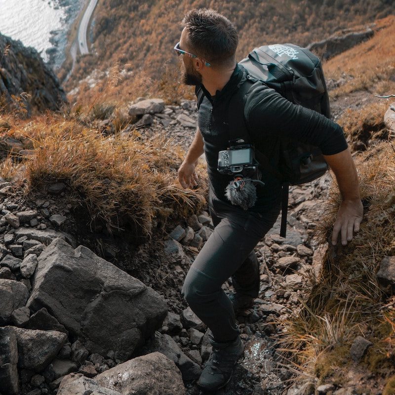 man hiking with pack.