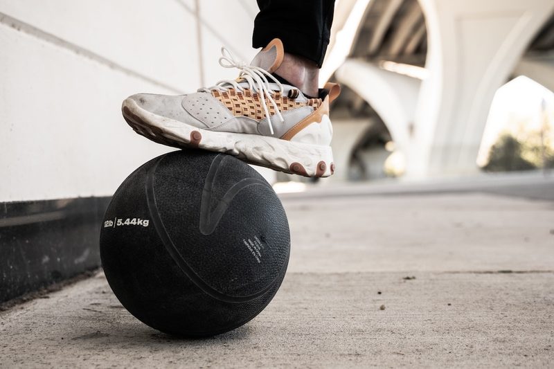 Sneaker on top of medicine ball.