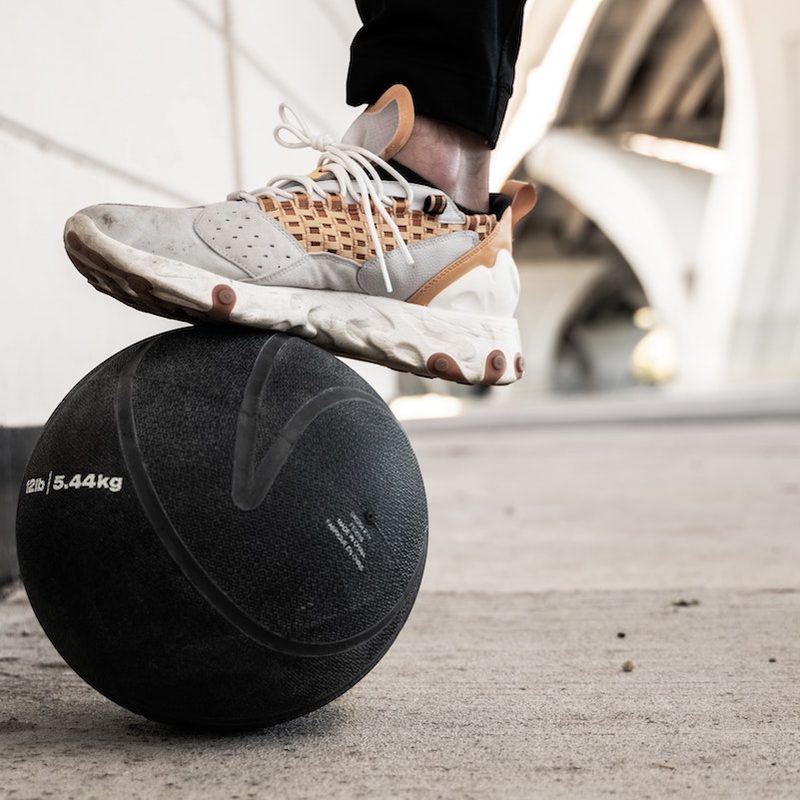 Sneaker on top of medicine ball.