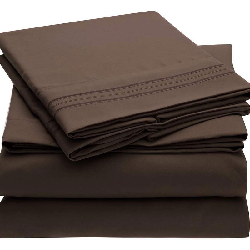 A neatly folded brown Mellani Hotel Luxury Bedding Sheets & Pillowcases.