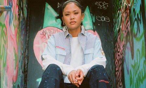 Modelo and UNKNWN's 'Fighting Spirits' collection with paint-splattered cargo pants, a custom patched and blue-and-white-plaid button-down.