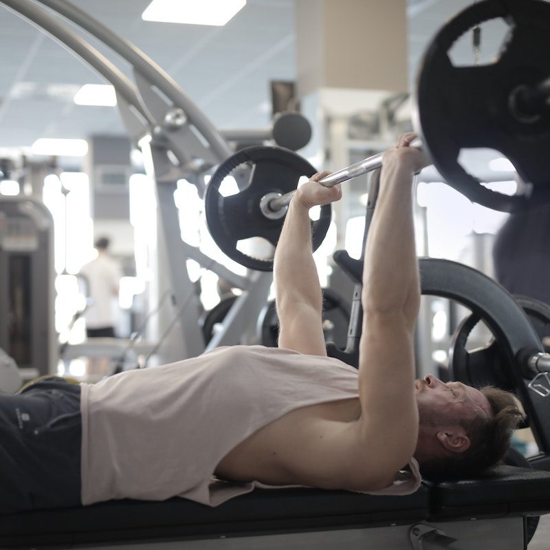man doing chest press.