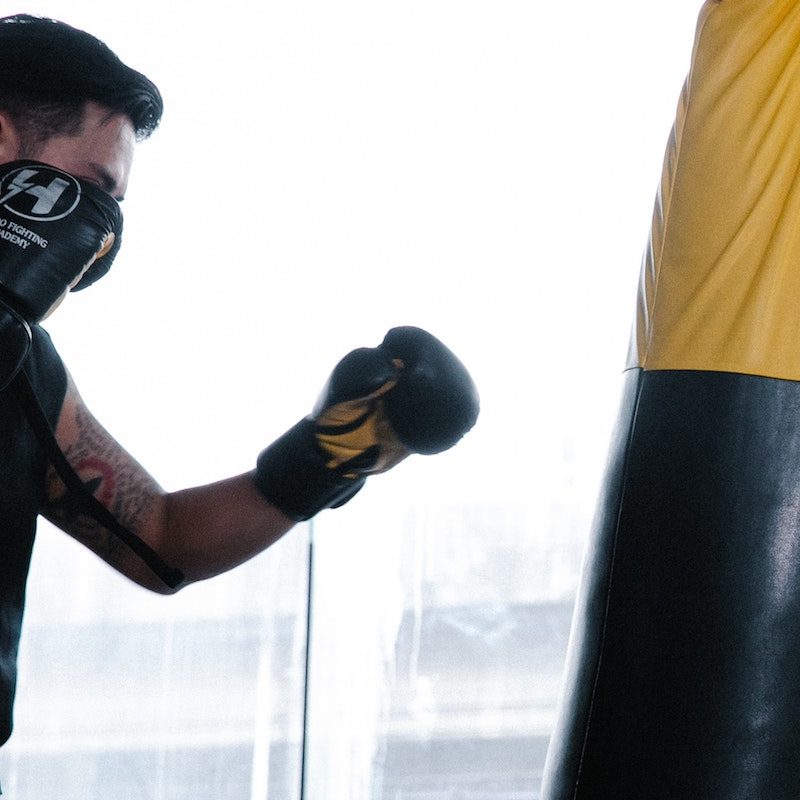 Man boxing with a punching bag