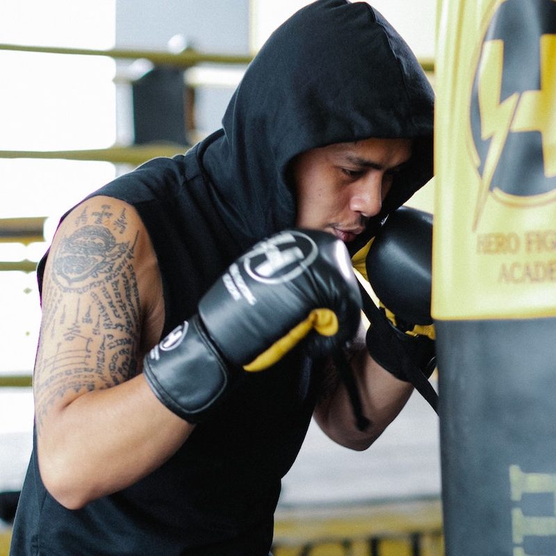 Man up close with punching bag