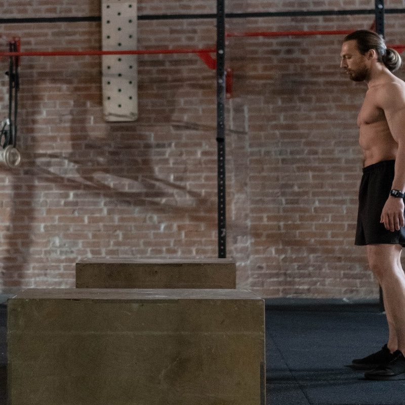Man about to do box jump.