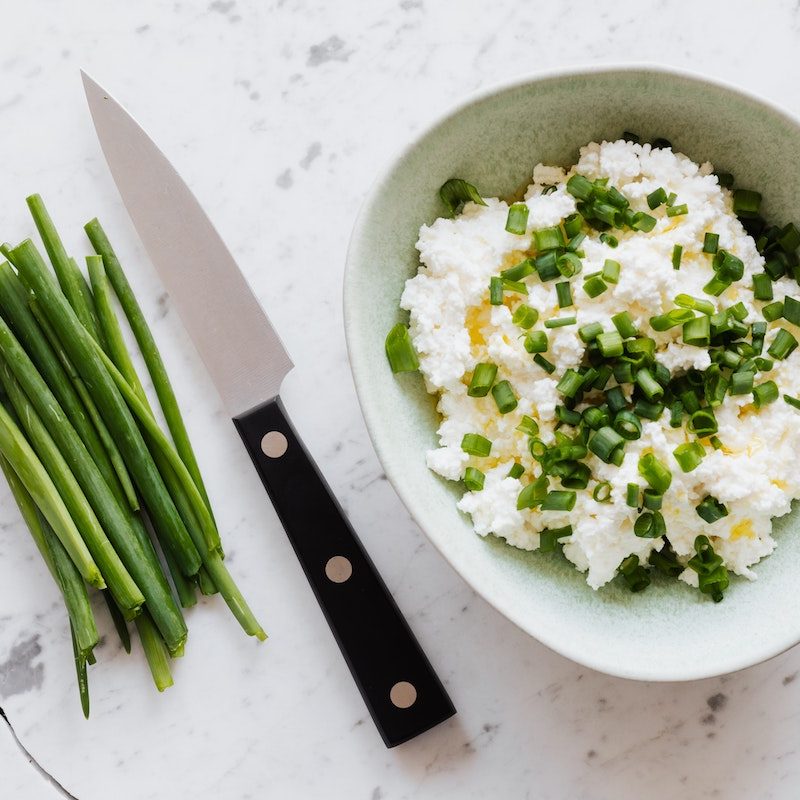 Cottage cheese with chives as a garnish.