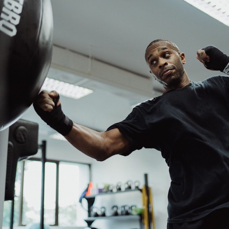 Man hitting a punching bag