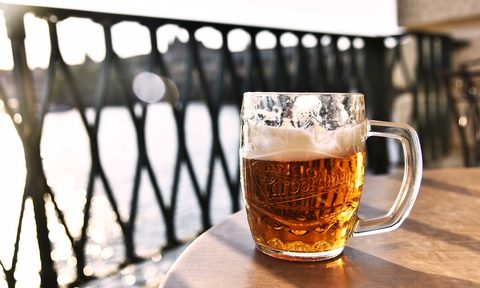 Mug of beer outside on a table