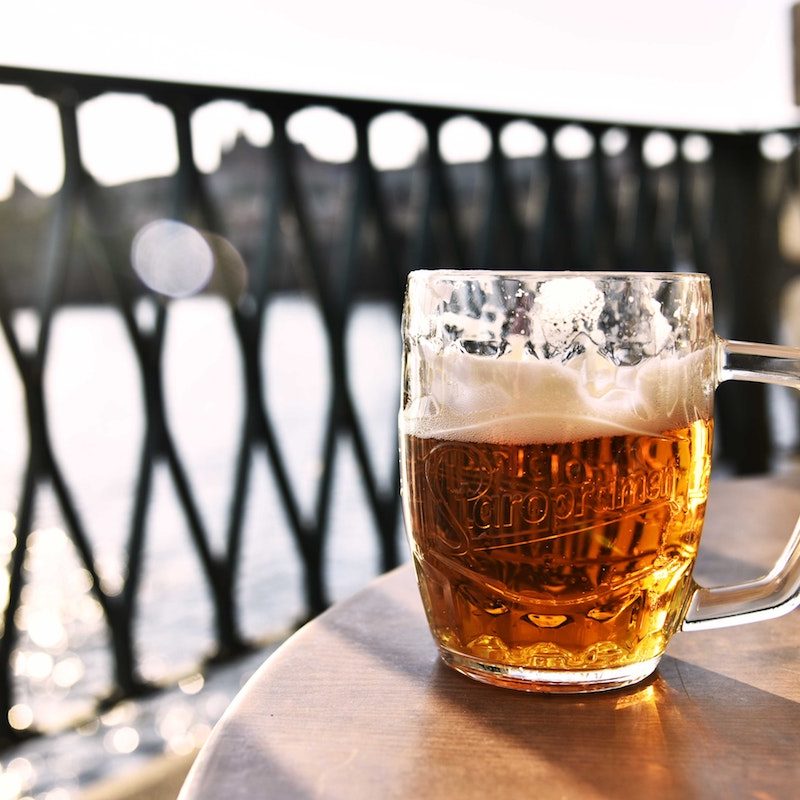 Mug of beer on a table.