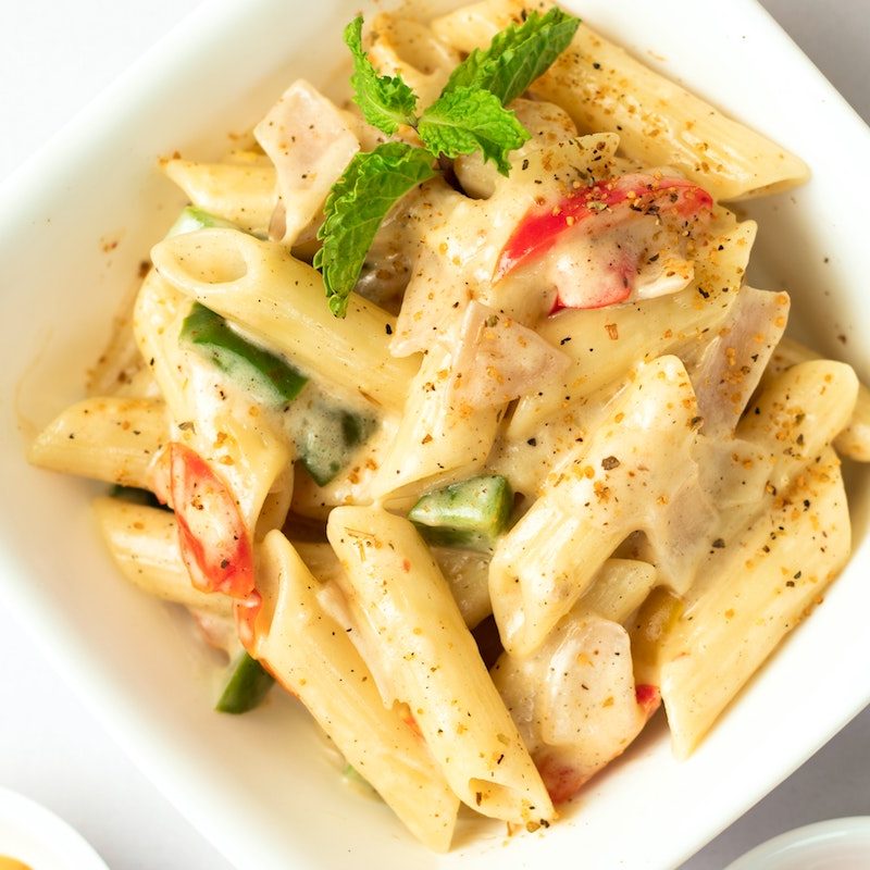 White penne pasta in a bowl