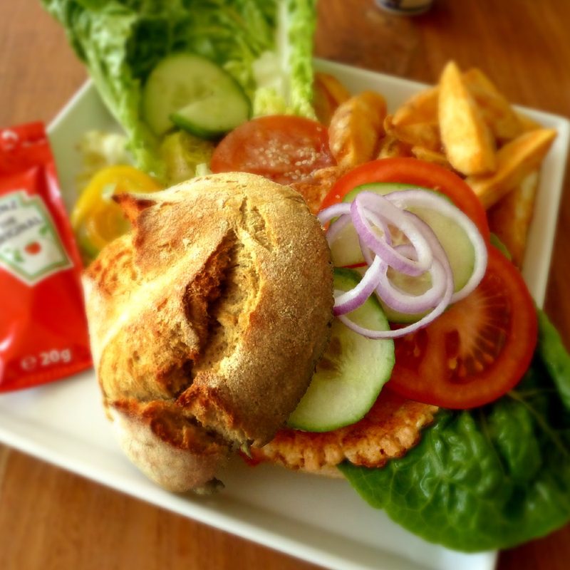Salmon burger with vegetables and fries