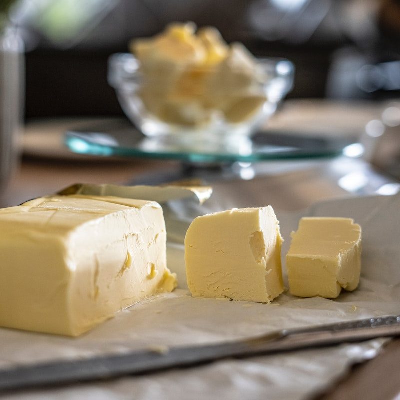 butter next to a knife.